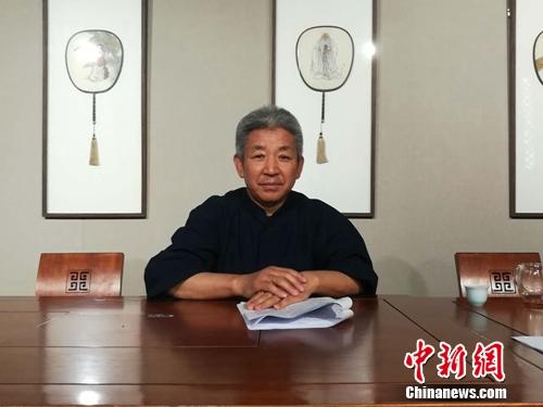 资料图：杨华山接受媒体采访。上官云 摄